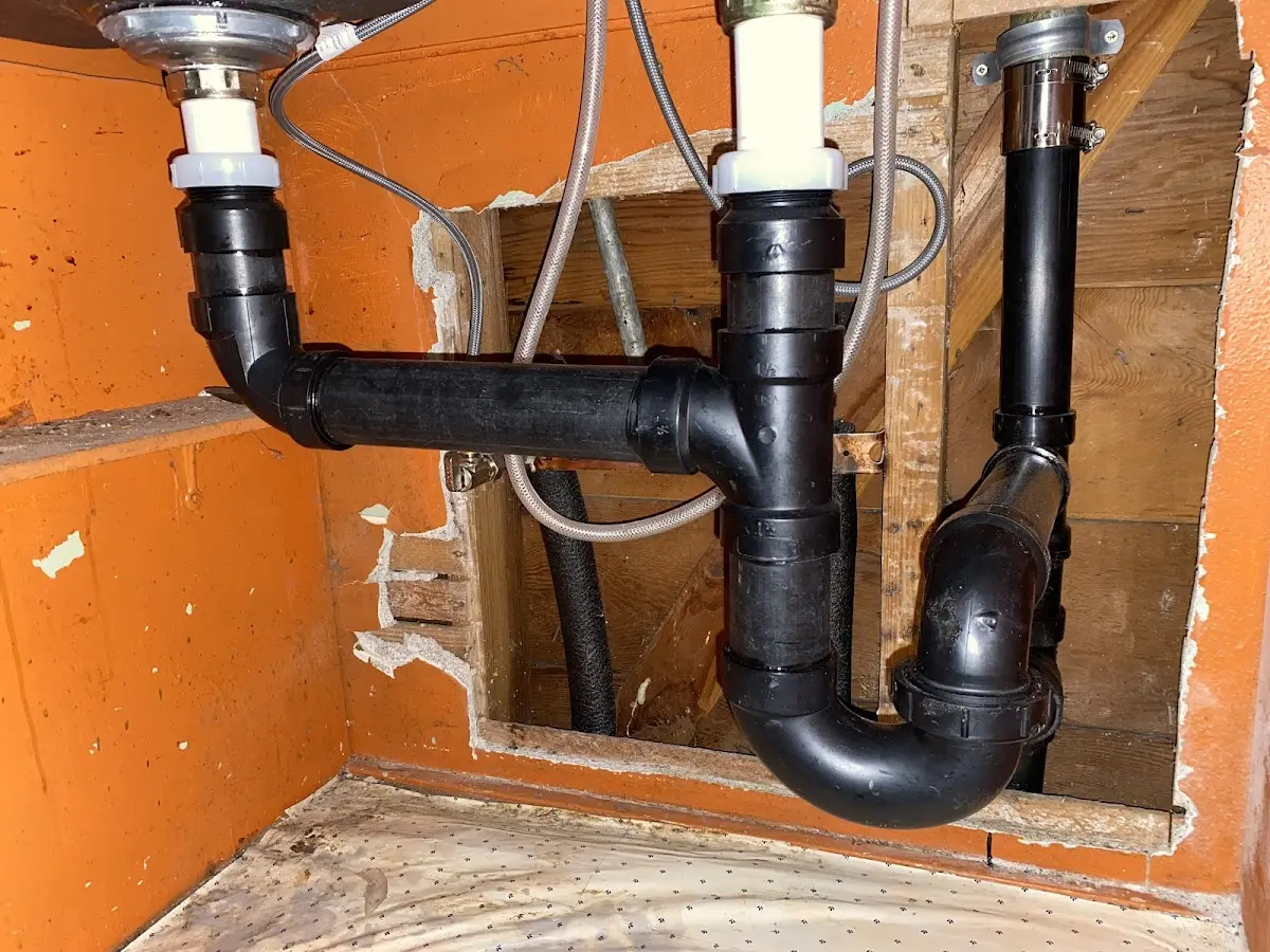 Professional Garbage Disposal Repair equipment and tools on the job in Garden City